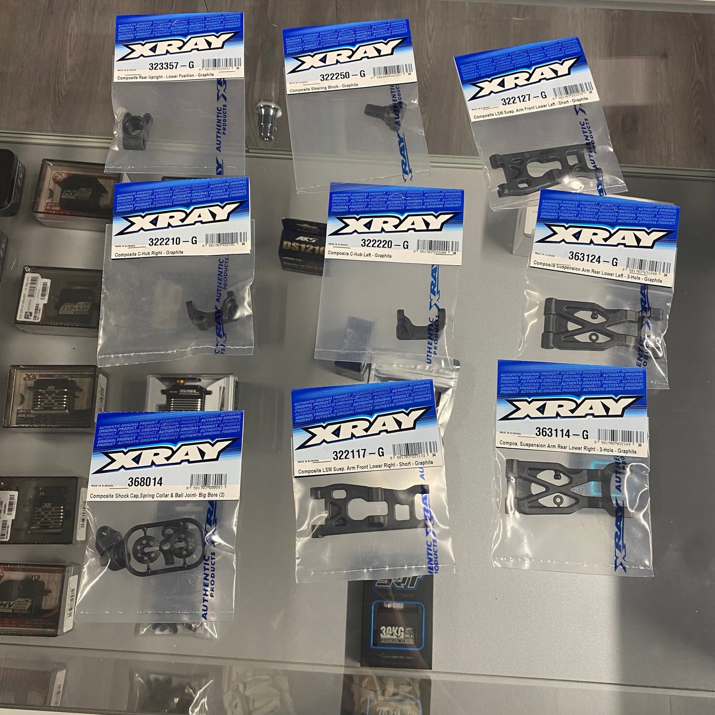 PRE-OWNED Xray XB2'25C + Nosram N22 Stock Spec 13.5T Motor + Hobbywing XR10 Pro G2S  + Sanwa PGS-LH II +  Ersatzteile